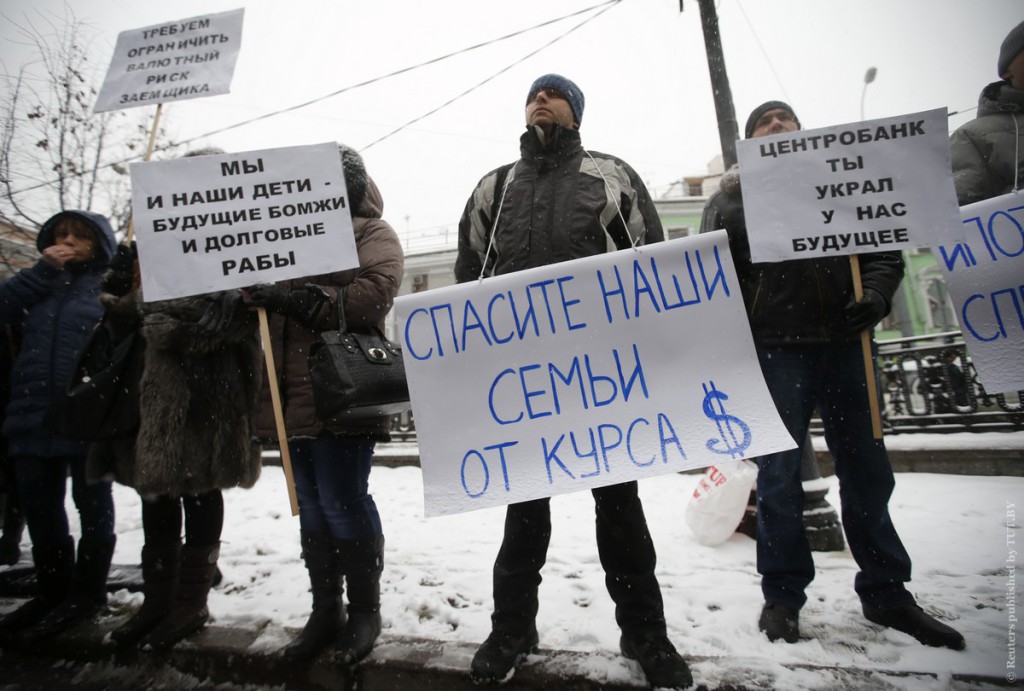 Protesters hold placards during a picket in central Moscow